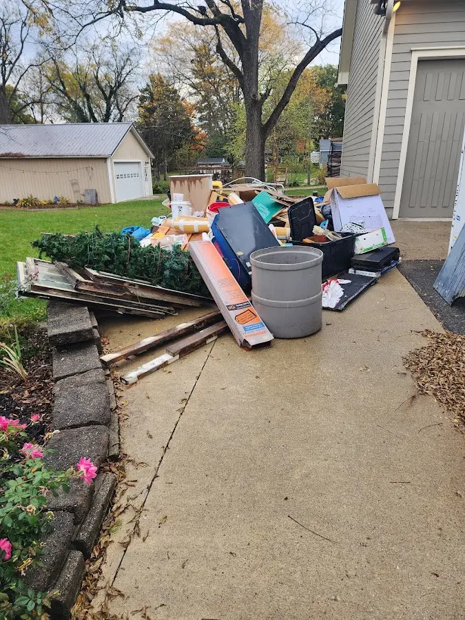 Dumpster being loaded with debris for Roofing Dumpster Rental in Yountville